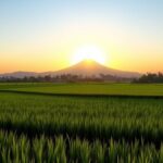 Ilustrasi AI sawah hijau dan siluet gunung saat matahari terbit